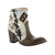 A pair of women's boots with a milk/khaki color scheme, featuring embroidery and a star design on the upper, with a brown sole and heel.