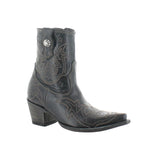Black cowboy boot with intricate designs on a white background