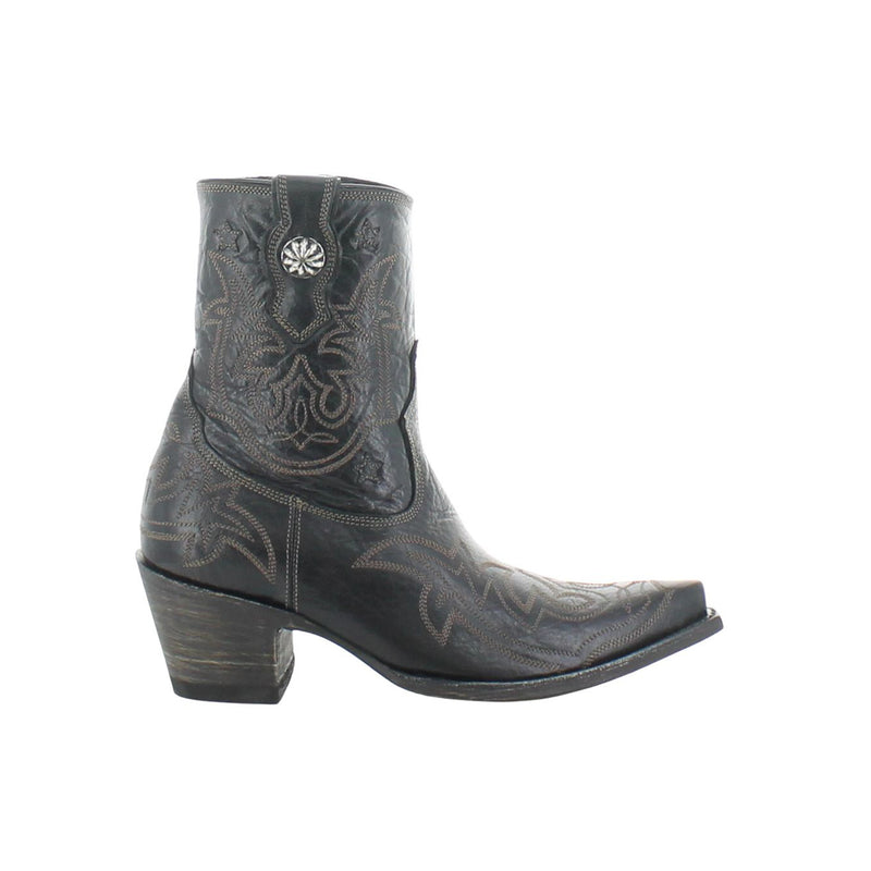 Black cowboy boot with intricate patterns on a white background