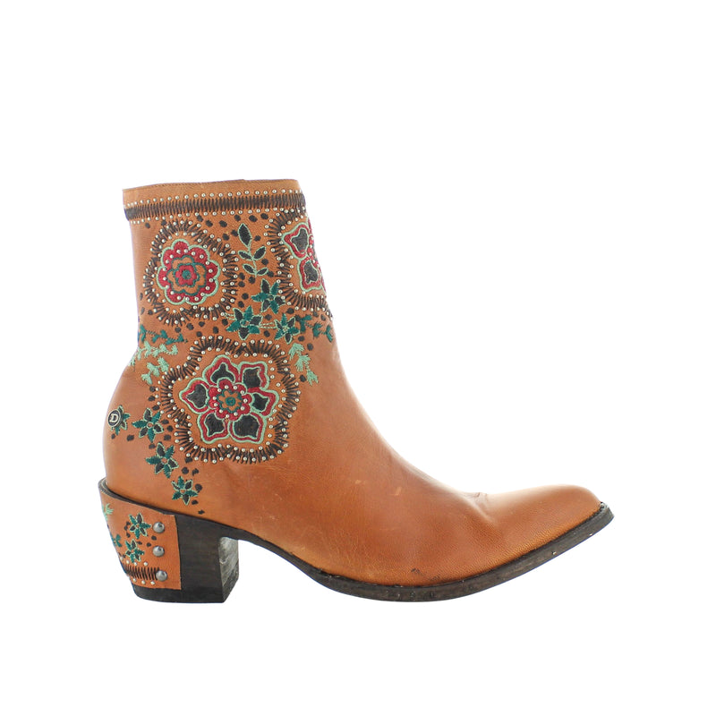 A tan-colored women's boot with embroidered detailing on the toe and heel.
