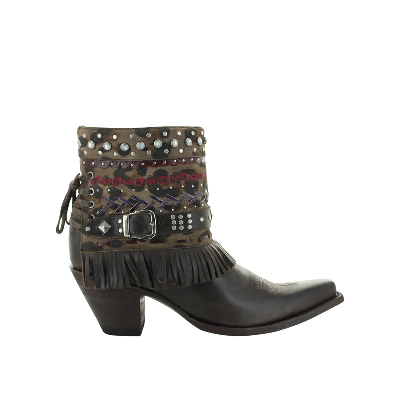 Brown cowboy boot with studs, braiding, and fringe on a white background