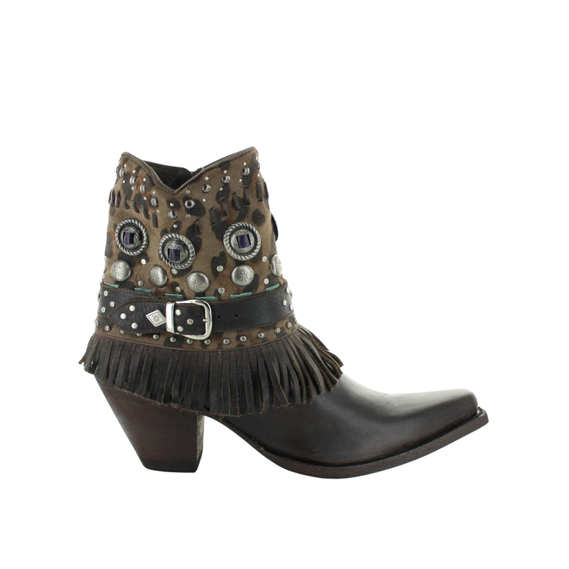 A brown leather boot featuring braided designs and metal studs.