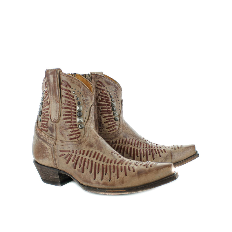 A beige-colored, long-toed women's boot with a high heel and decorative stitching on the upper.