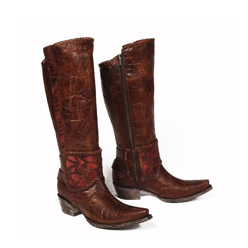 A pair of brown, braided leather women's boots with a high heel and long toe.